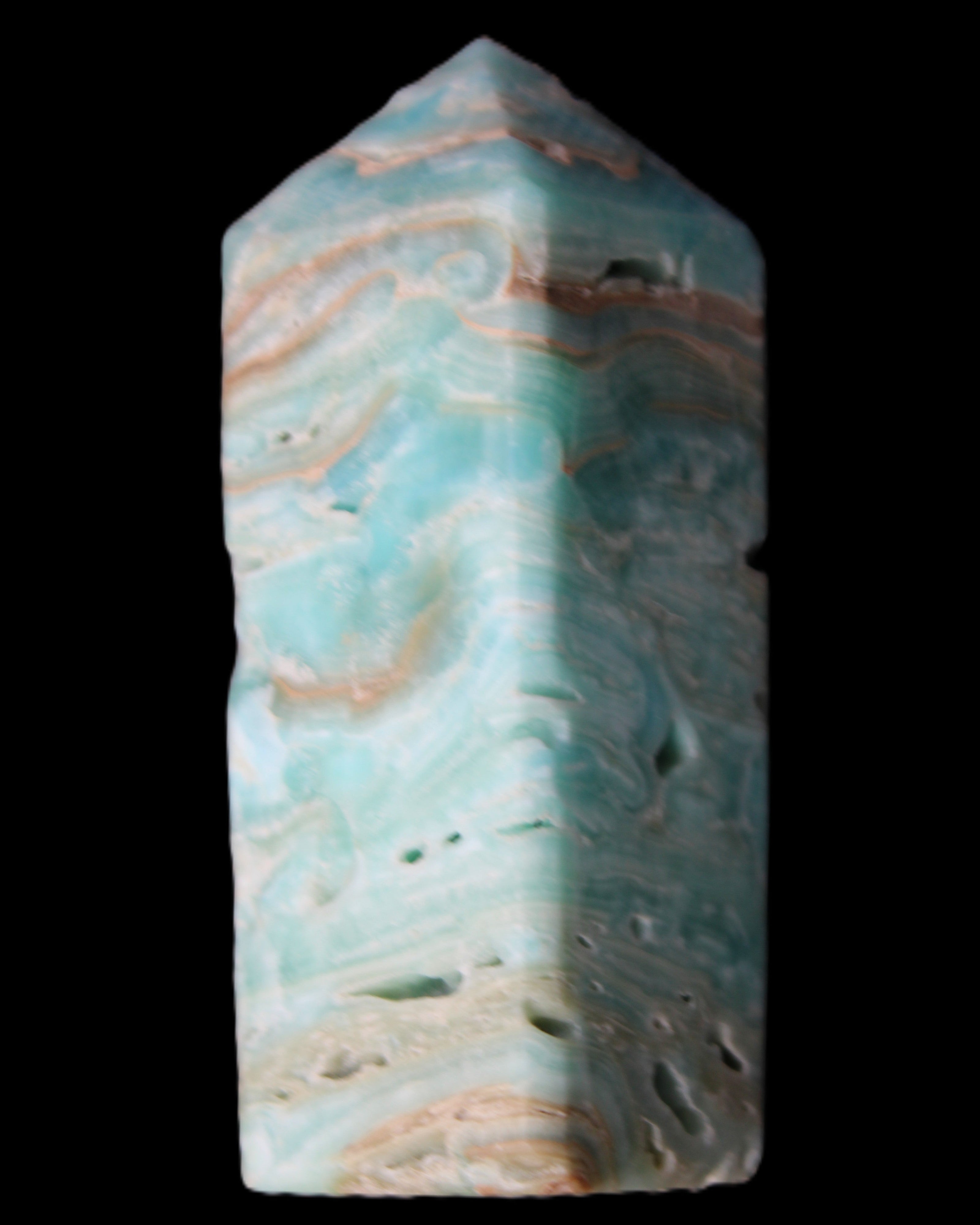 Caribbean Calcite Blue Aragonite obelisk 75*26mm 125g in sunlight - Rocks and Things Store