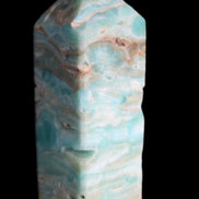 Caribbean Calcite Blue Aragonite obelisk 75*26mm 125g in sunlight - Rocks and Things Store