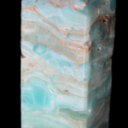 Caribbean Calcite Blue Aragonite obelisk 75*26mm 125g in sunlight - Rocks and Things Store