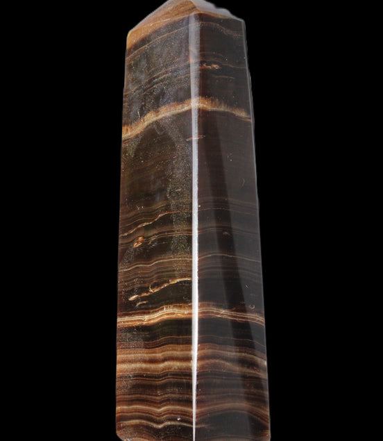 Chocolate Calcite obelisk 119*33 mm 222g in sunlight - Rocks and Things Store
