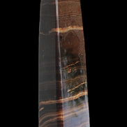 Chocolate Calcite obelisk 119*33 mm 222g in sunlight - Rocks and Things Store