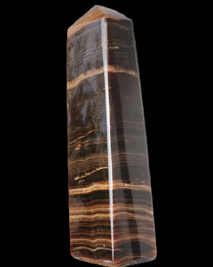 Chocolate Calcite obelisk 119*33 mm 222g in sunlight - Rocks and Things Store