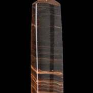 Chocolate Calcite obelisk 119*33 mm 222g in sunlight - Rocks and Things Store