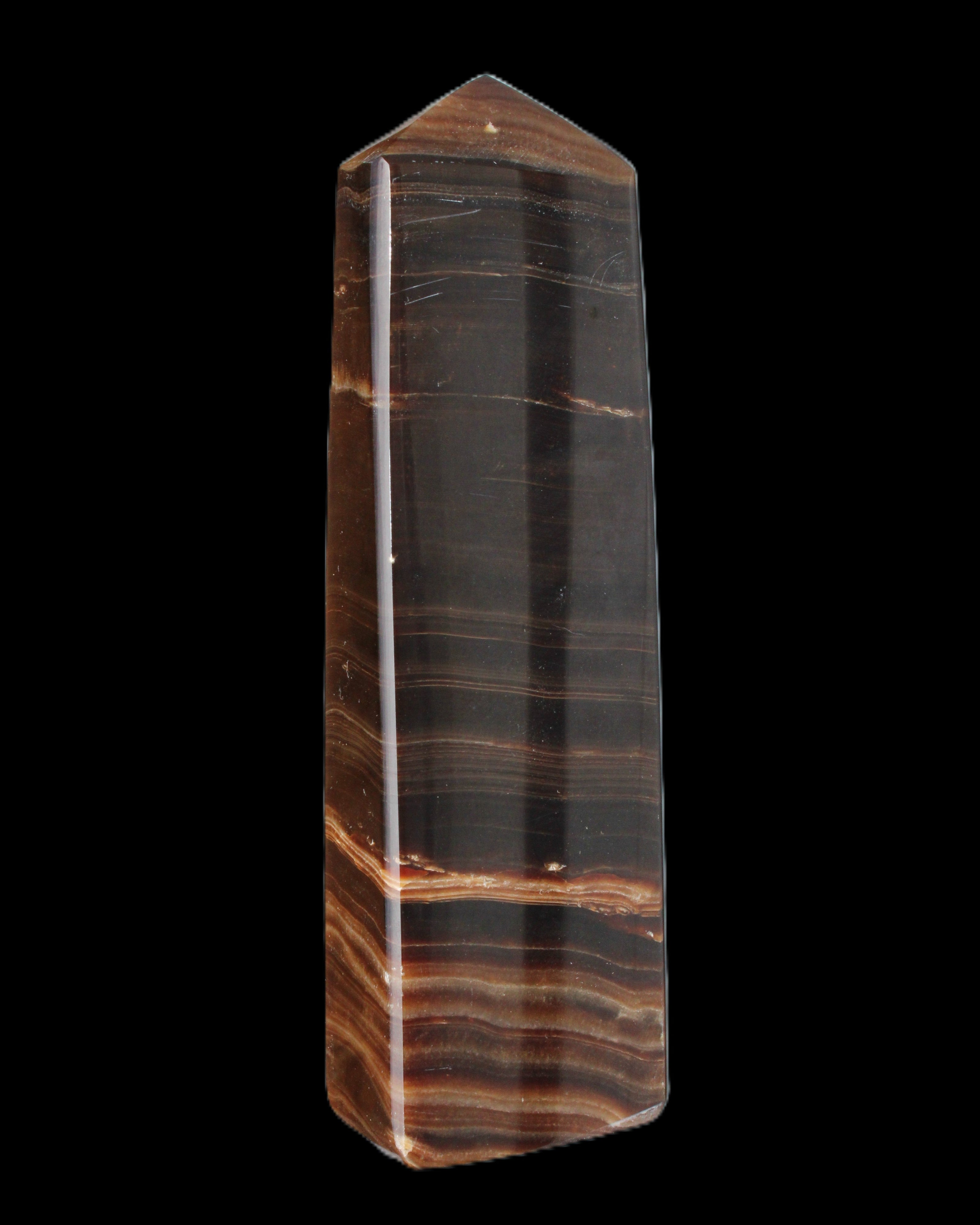 Chocolate Calcite obelisk 119*33 mm 222g in sunlight - Rocks and Things Store