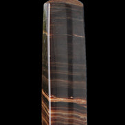 Chocolate Calcite obelisk 119*33 mm 222g in sunlight - Rocks and Things Store