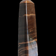 Chocolate Calcite obelisk 119*33 mm 222g in sunlight - Rocks and Things Store