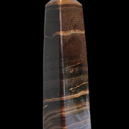Chocolate Calcite obelisk 119*33 mm 222g in sunlight - Rocks and Things Store