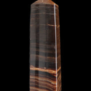 Chocolate Calcite obelisk 119*33 mm 222g in sunlight - Rocks and Things Store