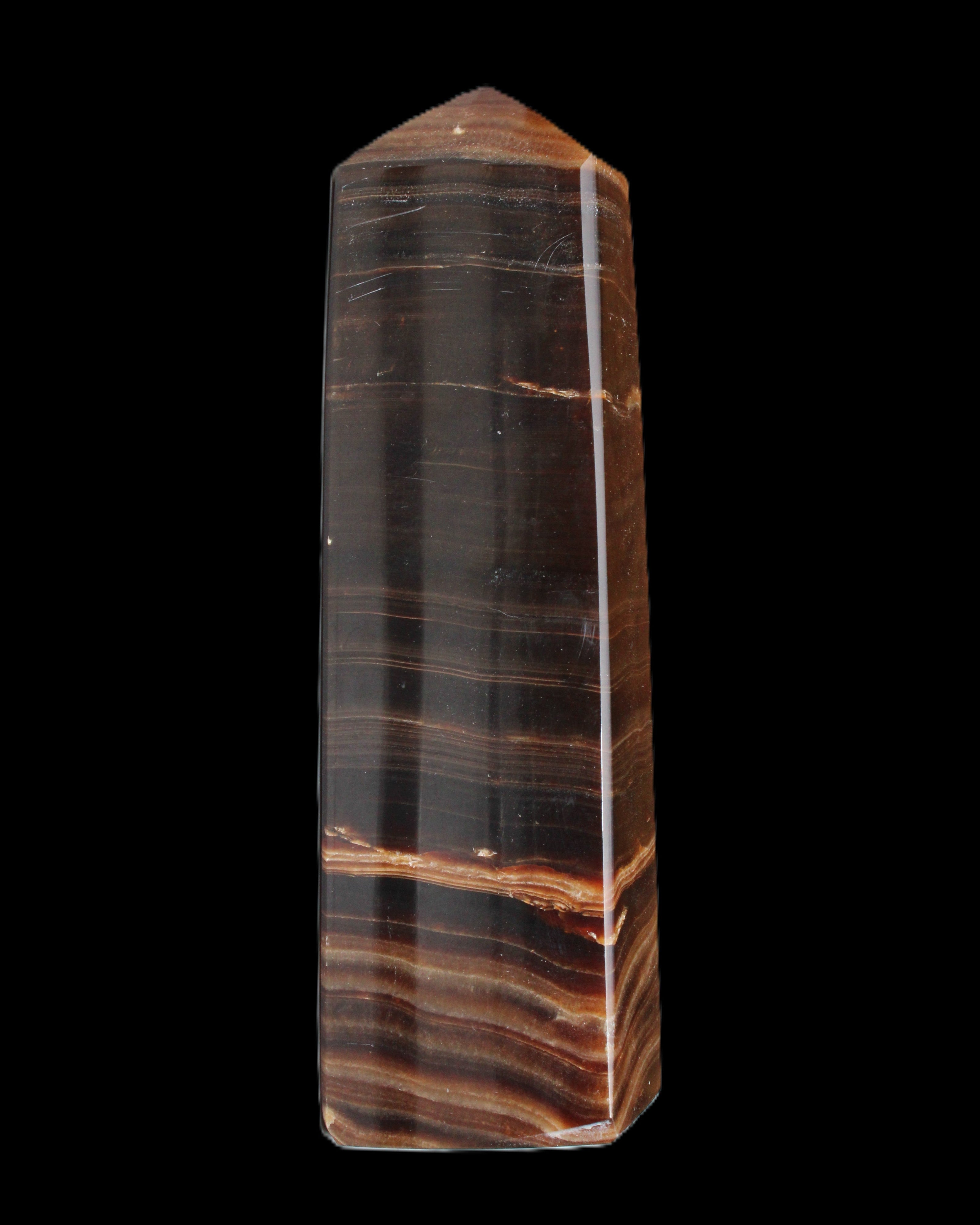 Chocolate Calcite obelisk 119*33 mm 222g in sunlight - Rocks and Things Store