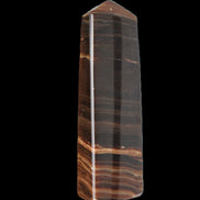 Chocolate Calcite obelisk 119*33 mm 222g in sunlight - Rocks and Things Store