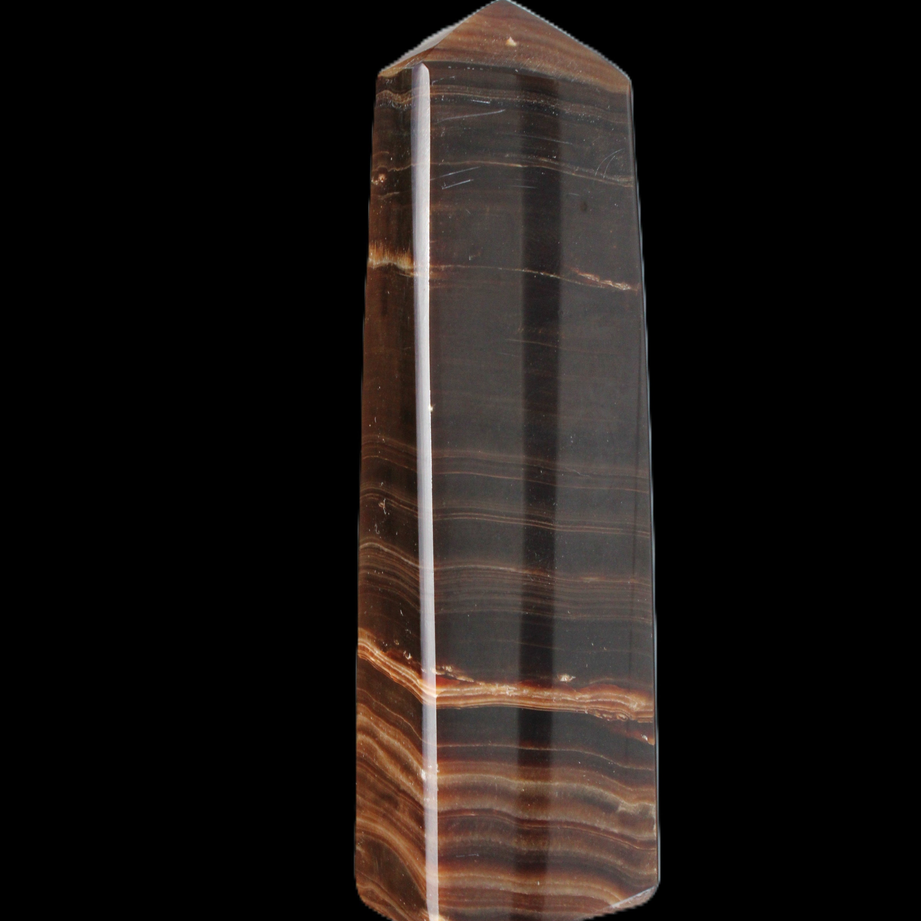 Chocolate Calcite obelisk 119*33 mm 222g in sunlight - Rocks and Things Store