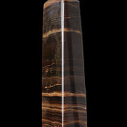 Chocolate Calcite obelisk 119*33 mm 222g in sunlight - Rocks and Things Store