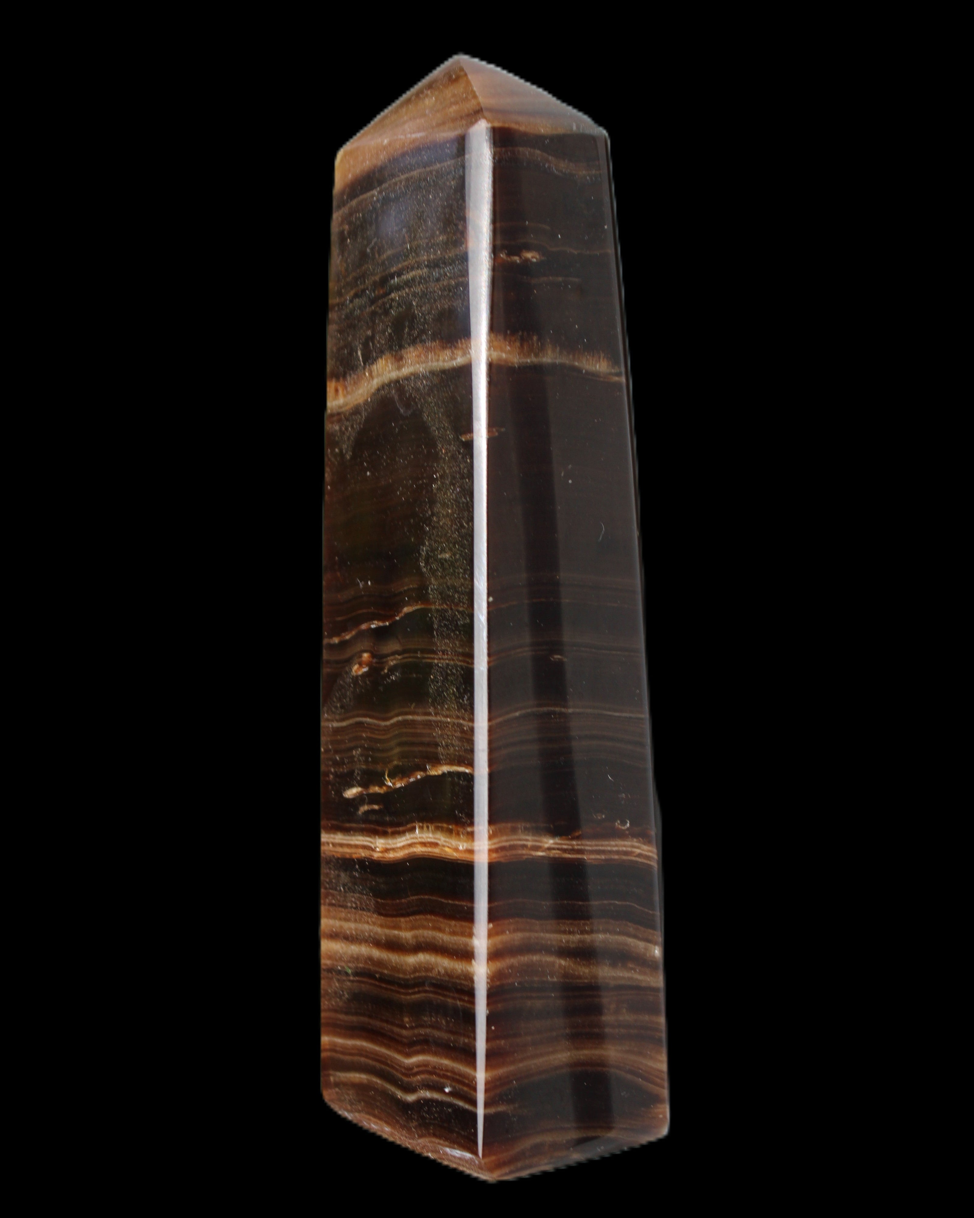 Chocolate Calcite obelisk 119*33 mm 222g in sunlight - Rocks and Things Store