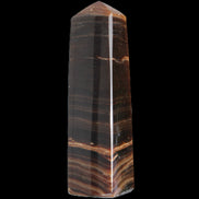Chocolate Calcite obelisk 119*33 mm 222g in sunlight - Rocks and Things Store