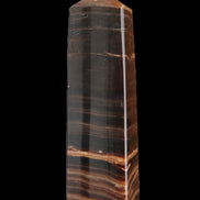 Chocolate Calcite obelisk 119*33 mm 222g in sunlight - Rocks and Things Store