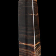 Chocolate Calcite obelisk 119*33 mm 222g in sunlight - Rocks and Things Store