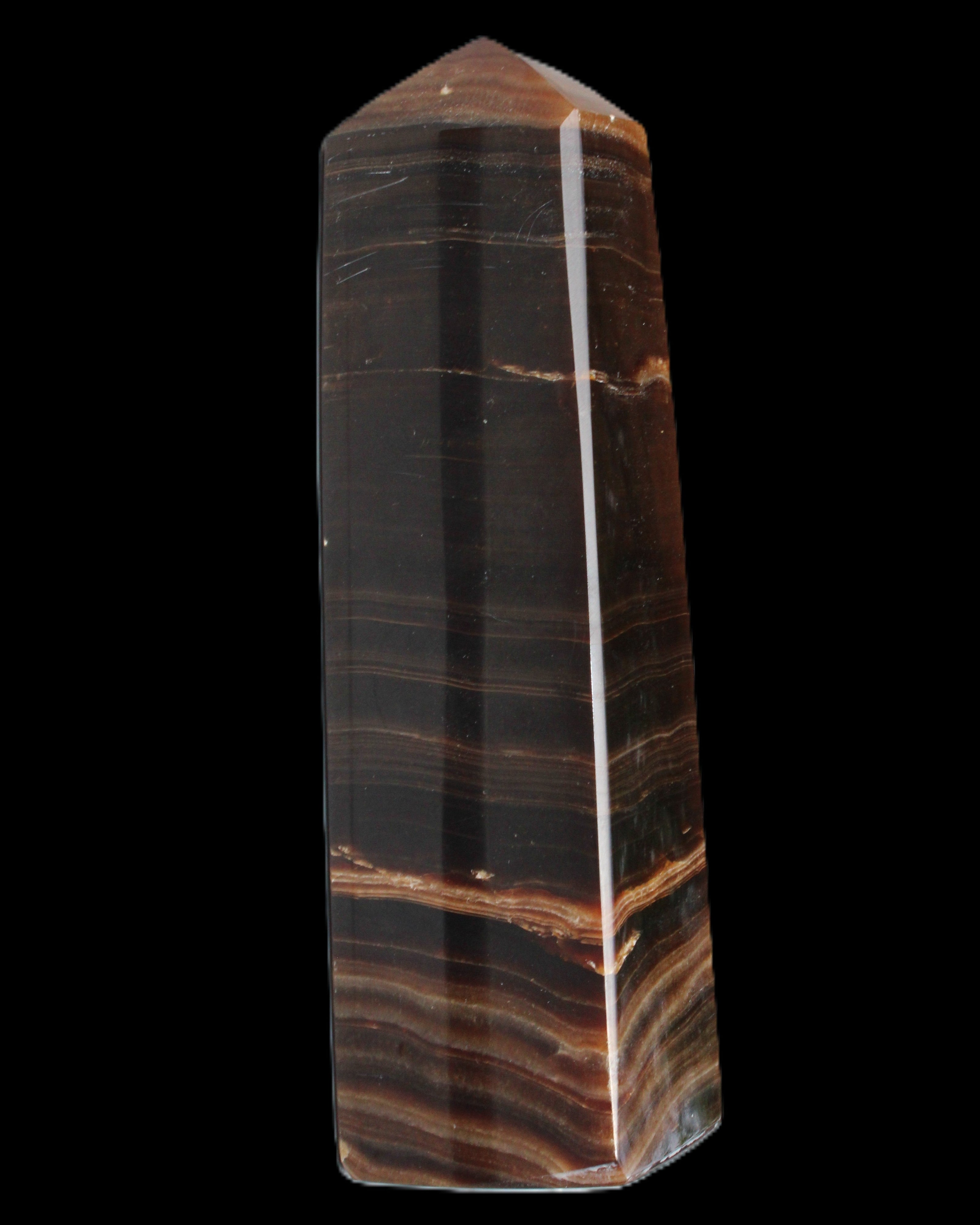 Chocolate Calcite obelisk 119*33 mm 222g in sunlight - Rocks and Things Store