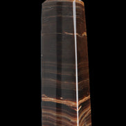 Chocolate Calcite obelisk 119*33 mm 222g in sunlight - Rocks and Things Store