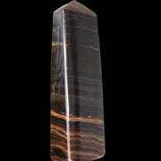 Chocolate Calcite obelisk 119*33 mm 222g in sunlight - Rocks and Things Store