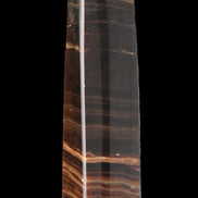 Chocolate Calcite obelisk 119*33 mm 222g in sunlight - Rocks and Things Store