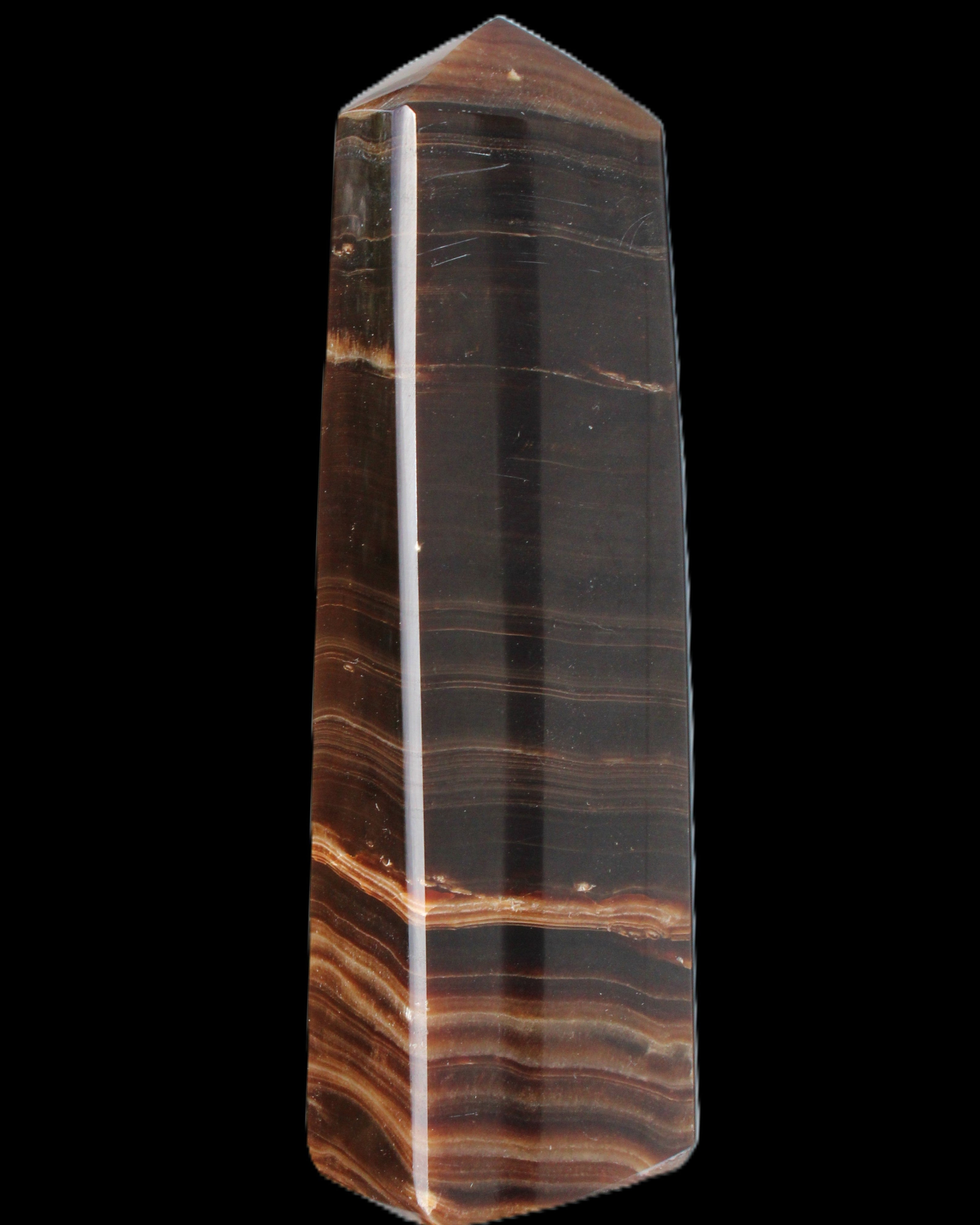 Chocolate Calcite obelisk 119*33 mm 222g in sunlight - Rocks and Things Store