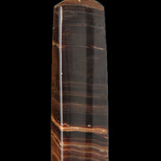 Chocolate Calcite obelisk 119*33 mm 222g in sunlight - Rocks and Things Store