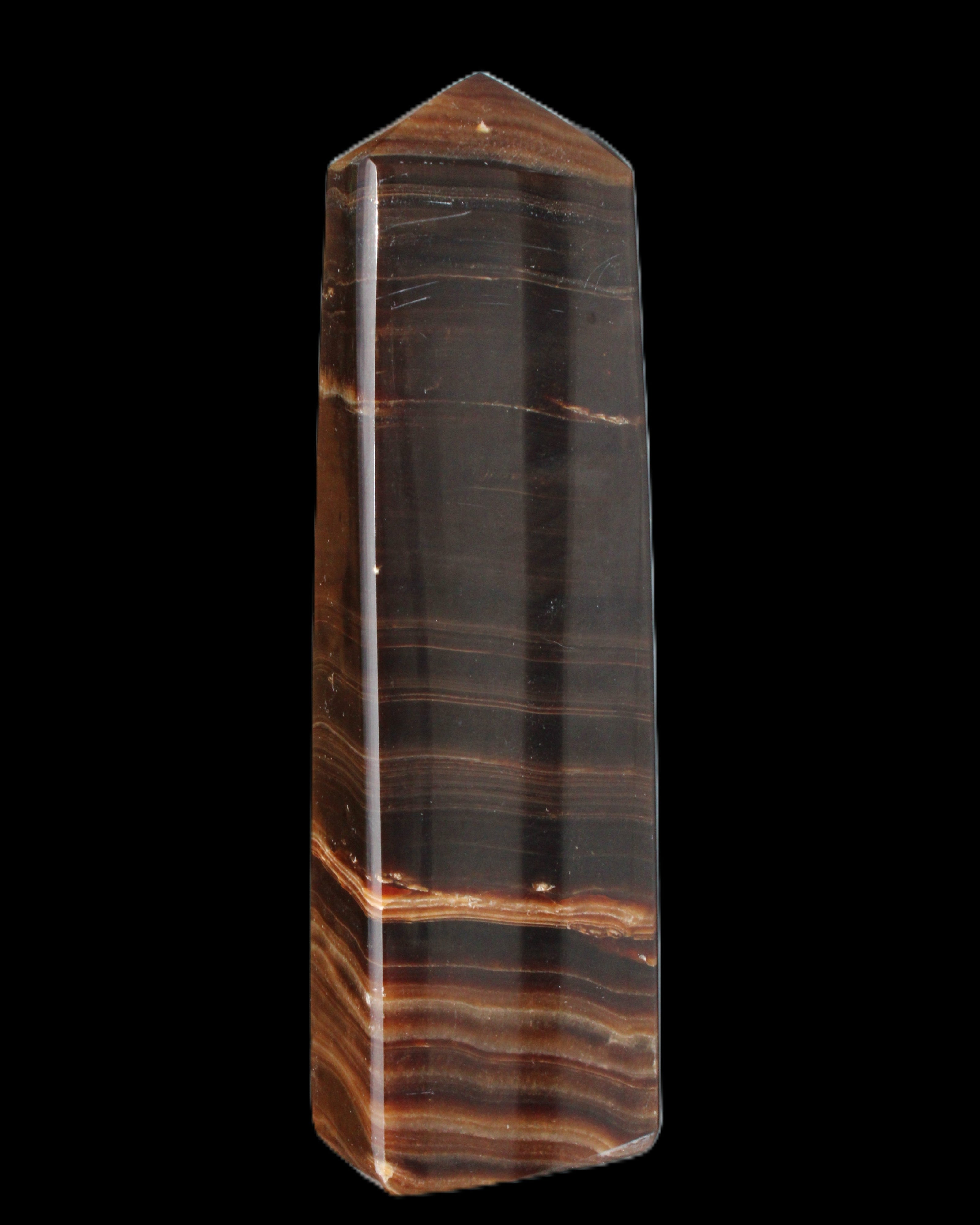 Chocolate Calcite obelisk 119*33 mm 222g in sunlight - Rocks and Things Store