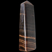 Chocolate Calcite obelisk 119*33 mm 222g in sunlight - Rocks and Things Store