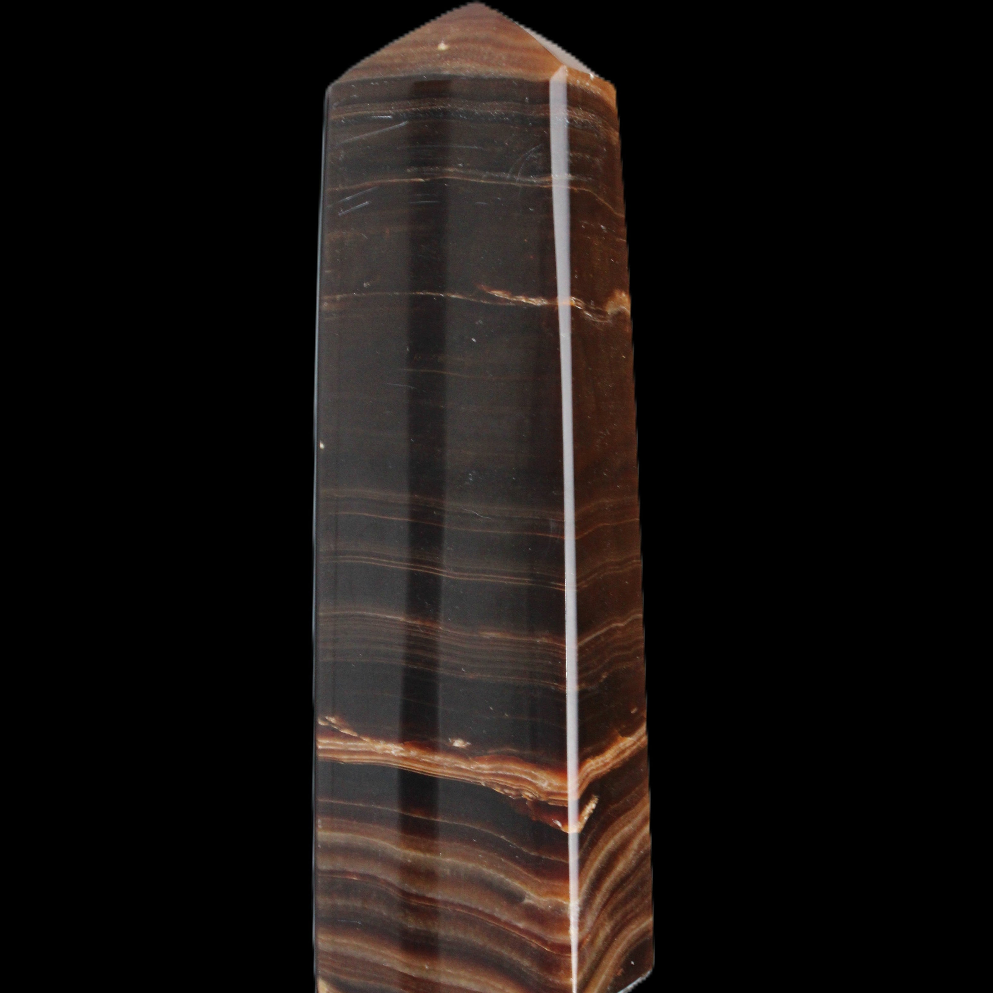 Chocolate Calcite obelisk 119*33 mm 222g in sunlight - Rocks and Things Store