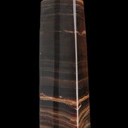 Chocolate Calcite obelisk 119*33 mm 222g in sunlight - Rocks and Things Store