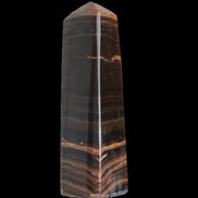 Chocolate Calcite obelisk 119*33 mm 222g in sunlight - Rocks and Things Store