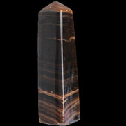Chocolate Calcite obelisk 119*33 mm 222g in sunlight - Rocks and Things Store