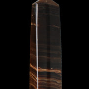 Chocolate Calcite obelisk 119*33 mm 222g in sunlight - Rocks and Things Store