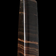 Chocolate Calcite obelisk 119*33 mm 222g in sunlight - Rocks and Things Store
