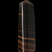 Chocolate Calcite obelisk 119*33 mm 222g in sunlight - Rocks and Things Store