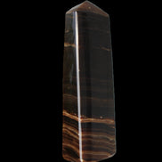 Chocolate Calcite obelisk 119*33 mm 222g in sunlight - Rocks and Things Store