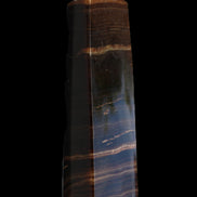 Chocolate Calcite obelisk 119*33 mm 222g in sunlight - Rocks and Things Store