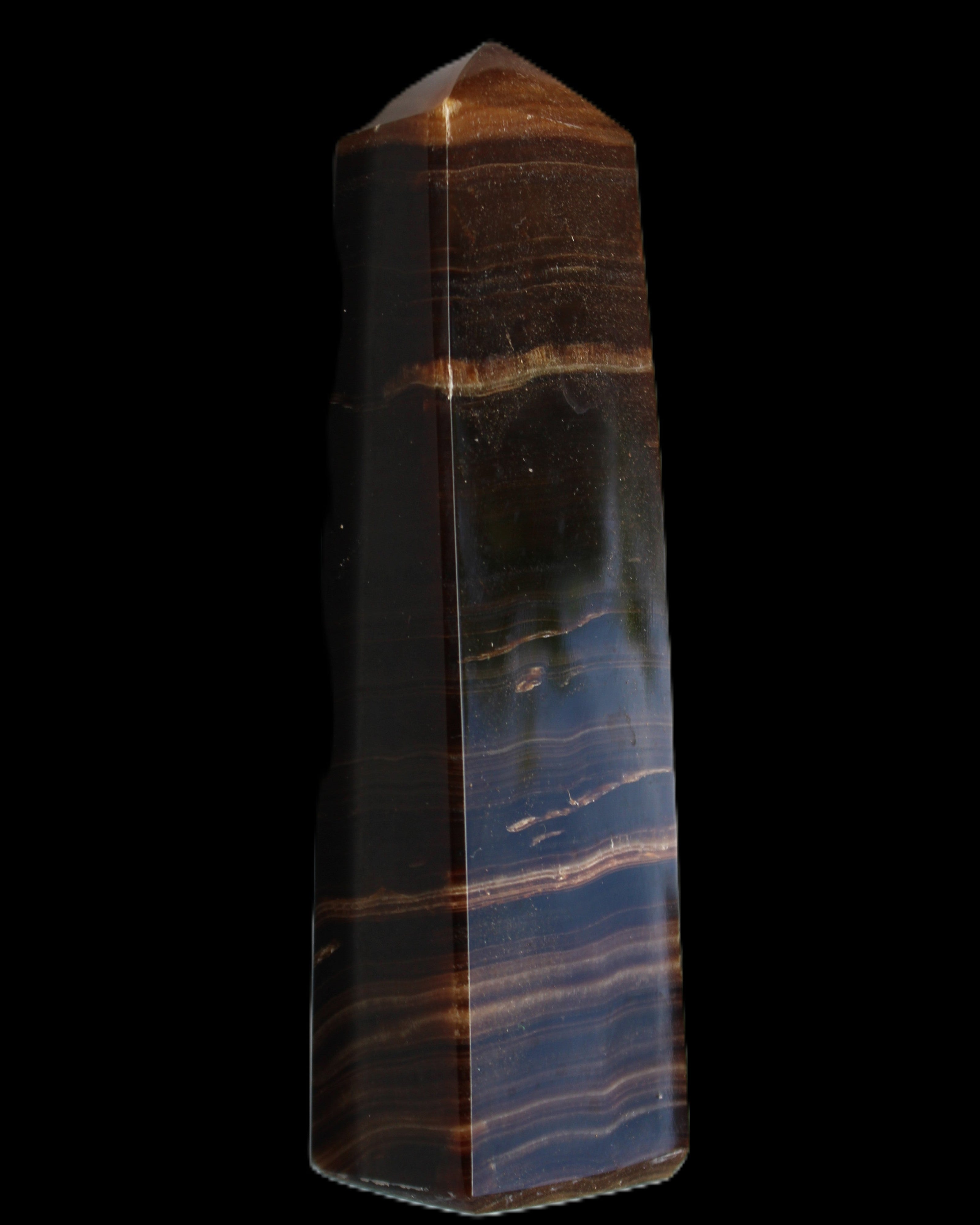Chocolate Calcite obelisk 119*33 mm 222g in sunlight - Rocks and Things Store