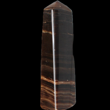 Chocolate Calcite obelisk 119*33 mm 222g in sunlight - Rocks and Things Store