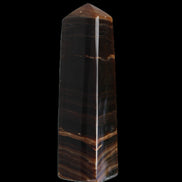 Chocolate Calcite obelisk 119*33 mm 222g in sunlight - Rocks and Things Store