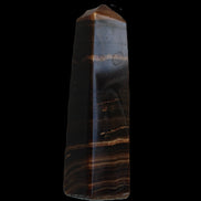 Chocolate Calcite obelisk 119*33 mm 222g in sunlight - Rocks and Things Store