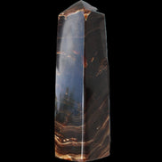 Chocolate Calcite obelisk 136*36mm 366g in sunlight - Rocks and Things Store