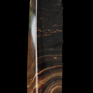 Chocolate Calcite obelisk 136*36mm 366g in sunlight - Rocks and Things Store