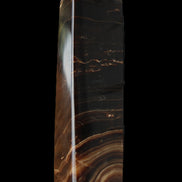 Chocolate Calcite obelisk 136*36mm 366g in sunlight - Rocks and Things Store