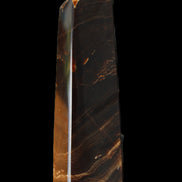 Chocolate Calcite obelisk 136*36mm 366g in sunlight - Rocks and Things Store