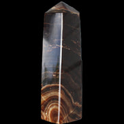 Chocolate Calcite obelisk 136*36mm 366g in sunlight - Rocks and Things Store