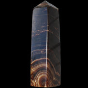 Chocolate Calcite obelisk 136*36mm 366g in sunlight - Rocks and Things Store