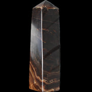 Chocolate Calcite obelisk 136*36mm 366g in sunlight - Rocks and Things Store