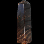 Chocolate Calcite obelisk 136*36mm 366g in sunlight - Rocks and Things Store