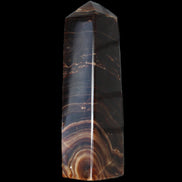 Chocolate Calcite obelisk 136*36mm 366g in sunlight - Rocks and Things Store